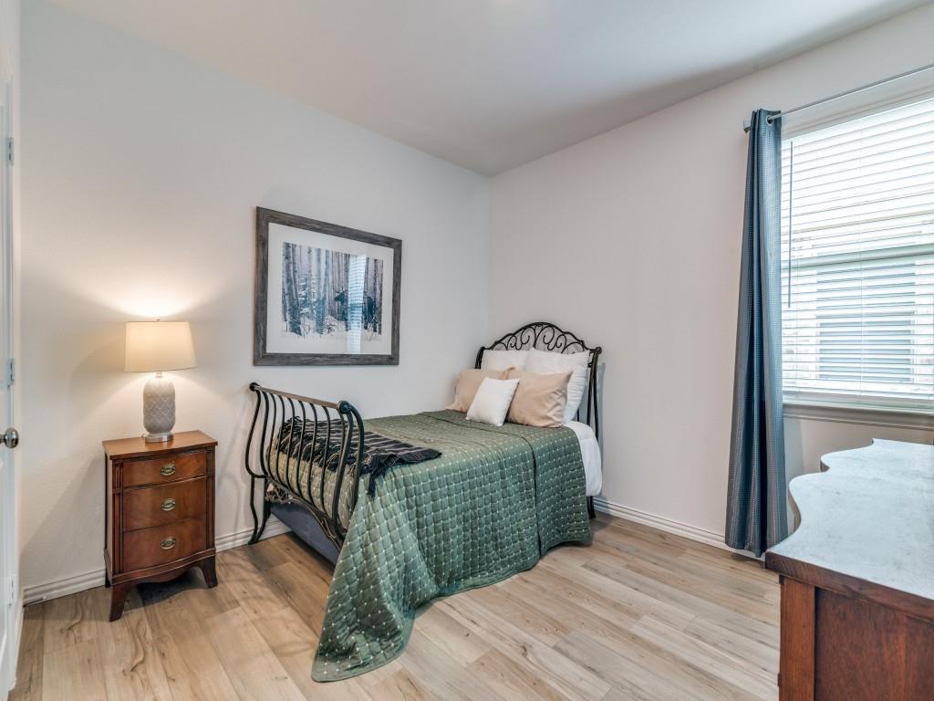 656 Beltrand Lane Fate, TX 75087 - Photo 13 of 22 Secondary bedroom with LVP flooring