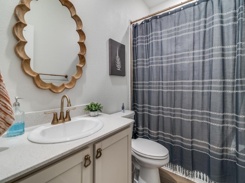 656 Beltrand Lane Fate, TX 75087 - Photo 14 of 22 Second full bathroom featuring vanity and combo tub/shower