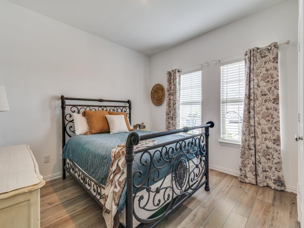 656 Beltrand Lane Fate, TX 75087 - Photo 15 of 22 Secondary Bedroom featuring LVP flooring