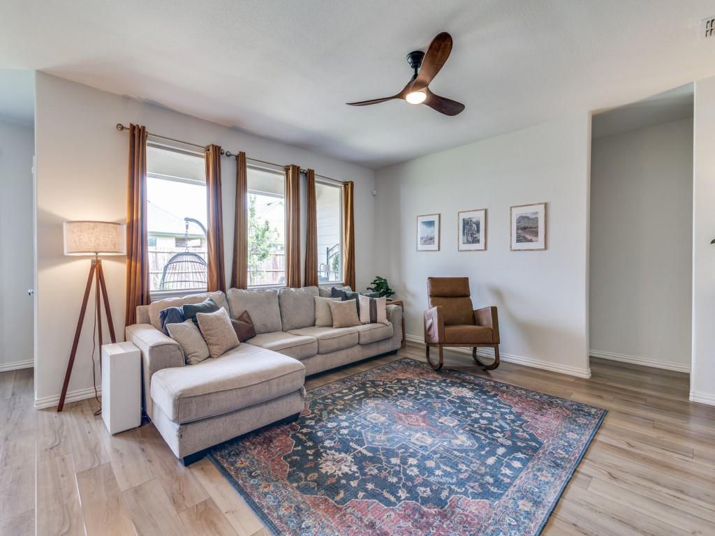 656 Beltrand Lane Fate, TX 75087 - Photo 2 of 22 Luxury vinyl plank flooring with an abundance of natural light