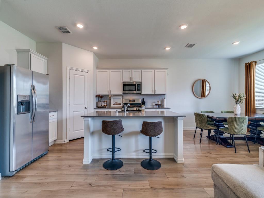 656 Beltrand Lane Fate, TX 75087 - Photo 5 of 22 Quartz countertops, gas range and stainless appliances