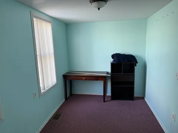 a room with window and closet