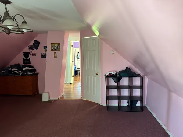a view of a livingroom with wooden floor and closet