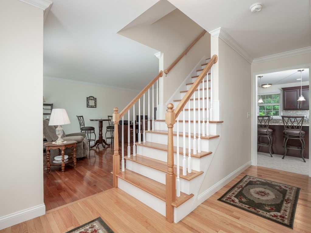 5 Clement Road Dracut, MA 01826 - Photo 8 of 42 a view of entryway livingroom and hall with wooden floor