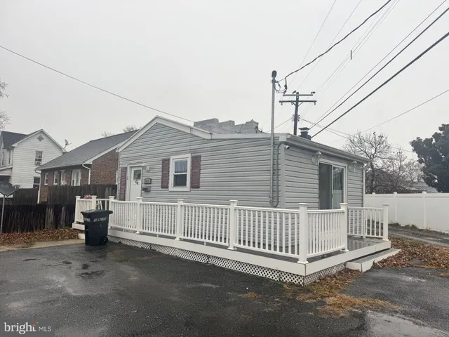 a view of a house with a fence