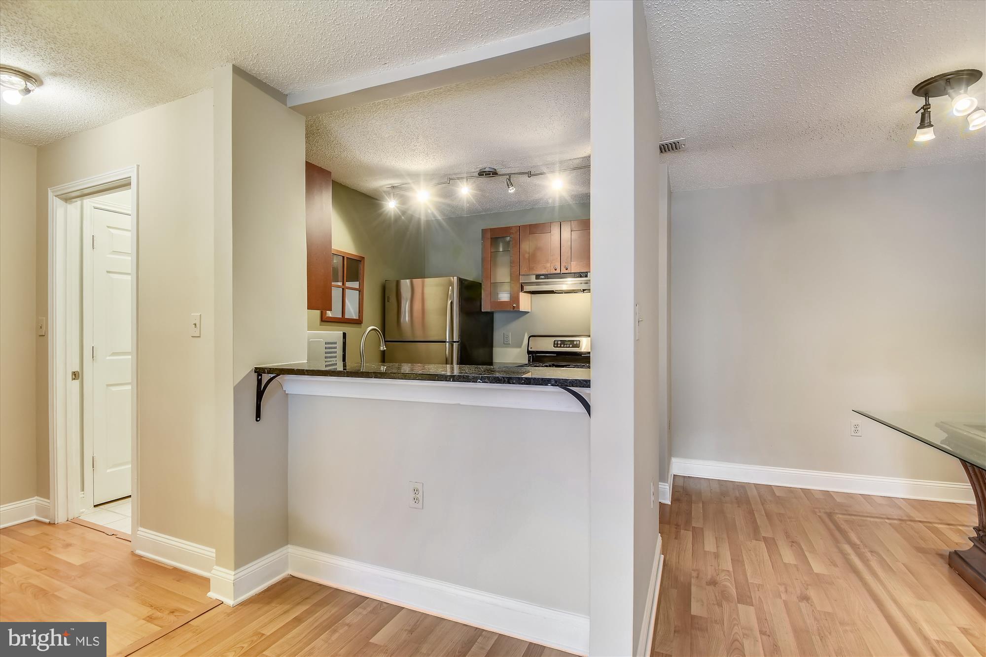 20979 Timber Ridge Terrace, Unit 204 Ashburn, VA 20147 - Photo 11 of 29 a view of a kitchen from the hallway