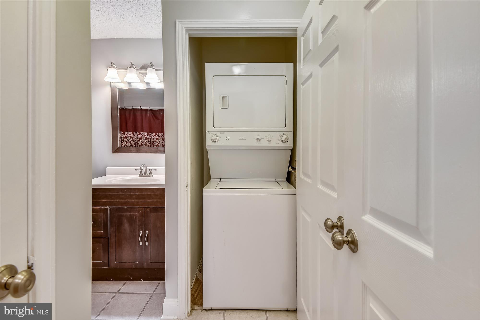 20979 Timber Ridge Terrace, Unit 204 Ashburn, VA 20147 - Photo 16 of 29 a bathroom with a toilet and a sink