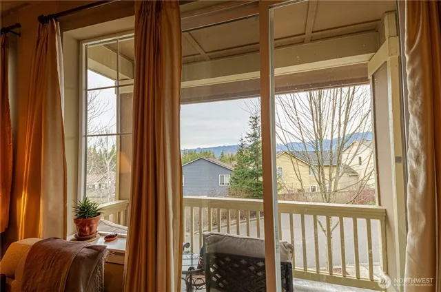 a view of a balcony with chair and the floor
