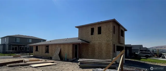 a front view of a house with parking space