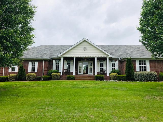 2024 Lakeview Road Spring Hill, TN 37174 - Photo 1 of 28 a front view of a house with a yard and green space