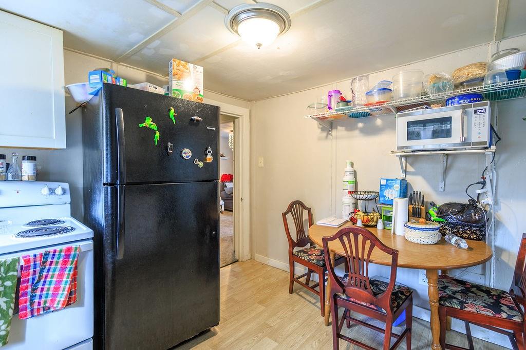 70 Daisy Circle Canton, GA 30114 - Photo 6 of 12 a kitchen with stainless steel appliances granite countertop a refrigerator and a table