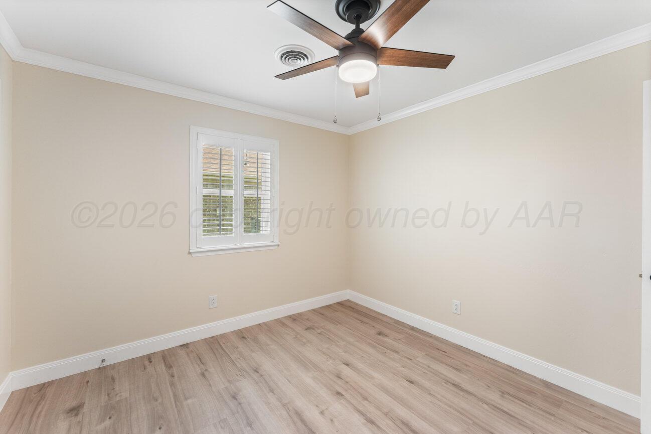 7204 Southwest 39th Avenue Amarillo, TX 79109 - Photo 36 of 51 an empty room with a window and a fan