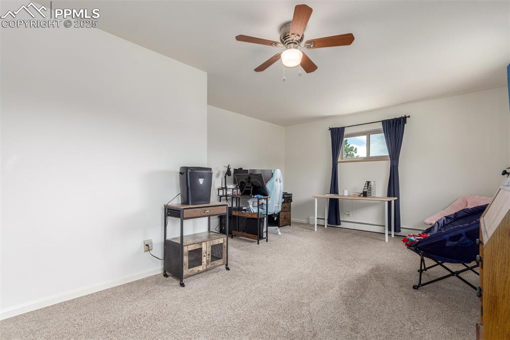19855 Draco Drive Monument, CO 80132 - Photo 22 of 44 Large bedroom on main level, currently being used as an office.