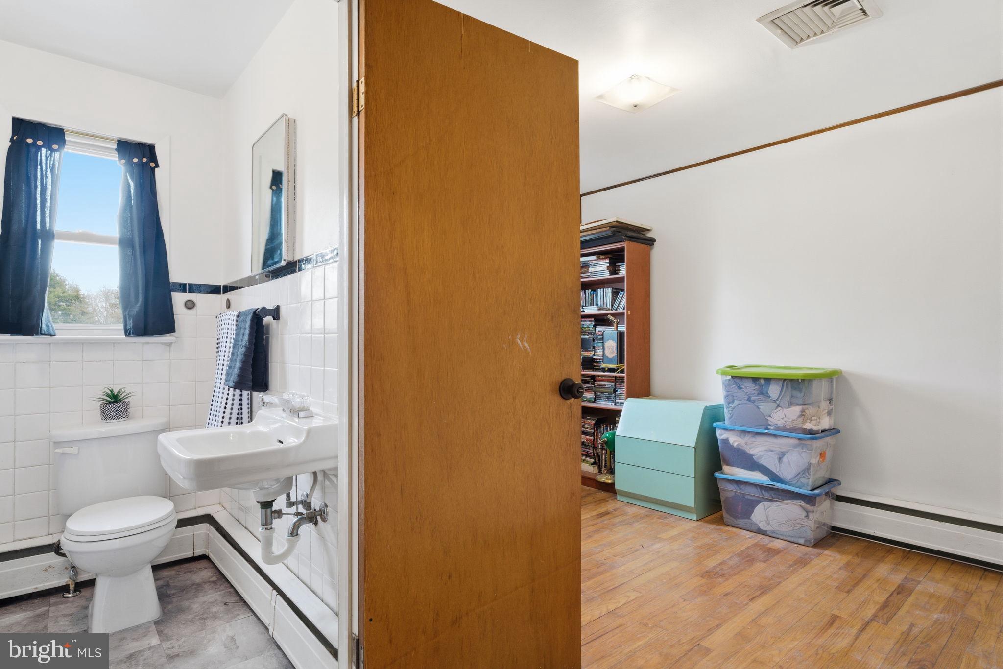 3517 Bristol Road Bensalem, PA 19020 - Photo 13 of 35 a bathroom with a toilet sink vanity tub and mirror
