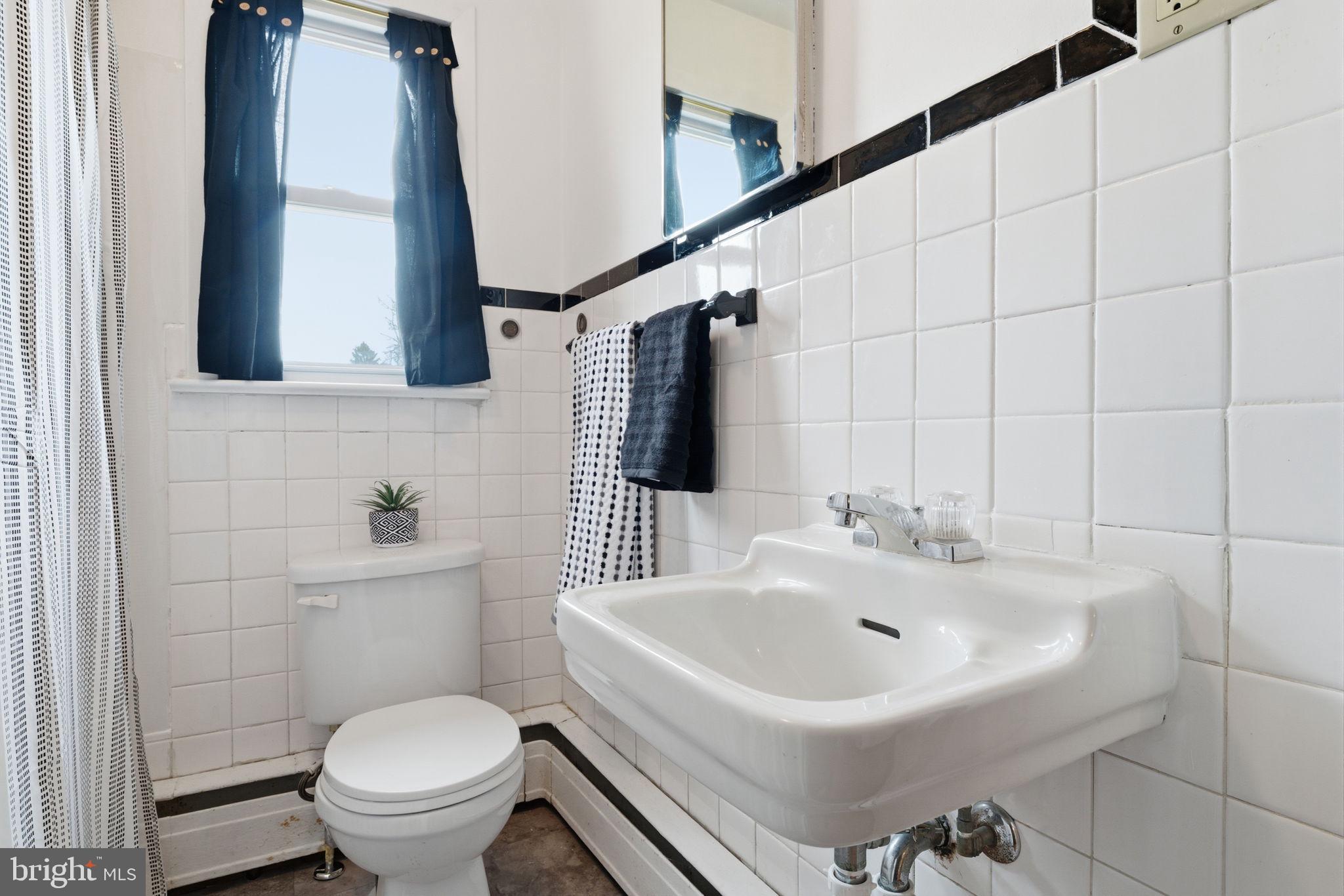 3517 Bristol Road Bensalem, PA 19020 - Photo 14 of 35 a bathroom with a sink toilet and mirror
