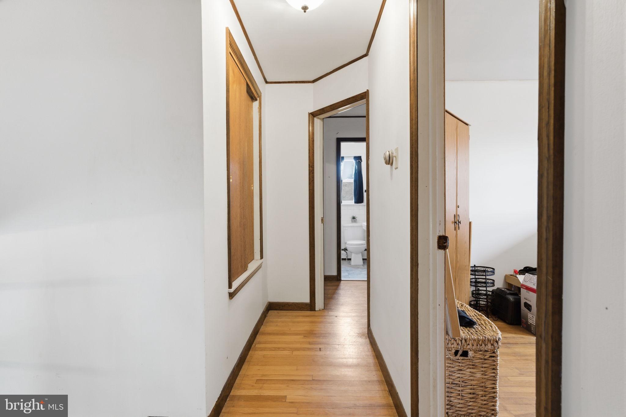 3517 Bristol Road Bensalem, PA 19020 - Photo 20 of 35 a view of a hallway with a livingroom and a bathroom with a sink