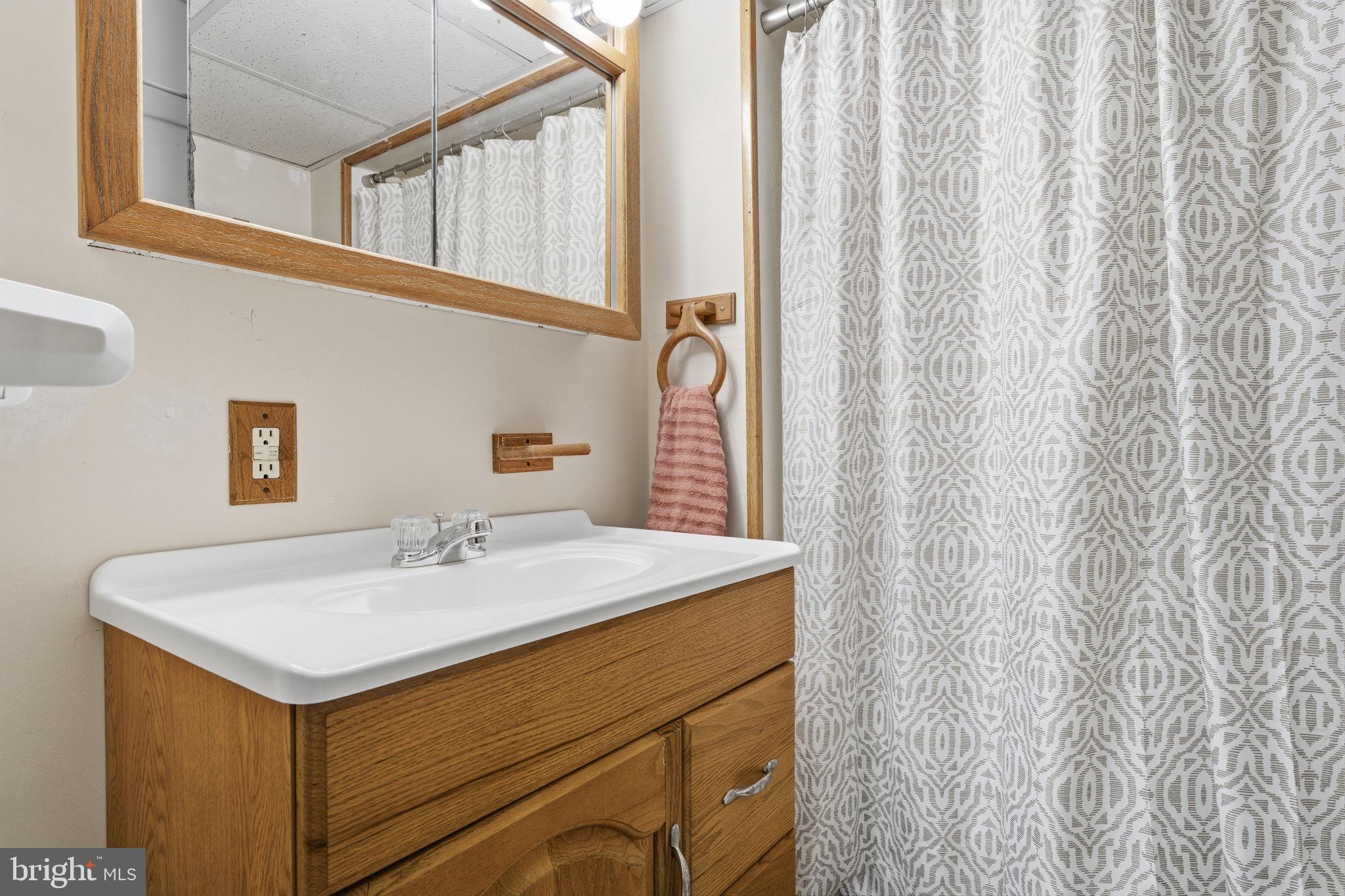 3517 Bristol Road Bensalem, PA 19020 - Photo 21 of 35 a bathroom with a sink and a mirror