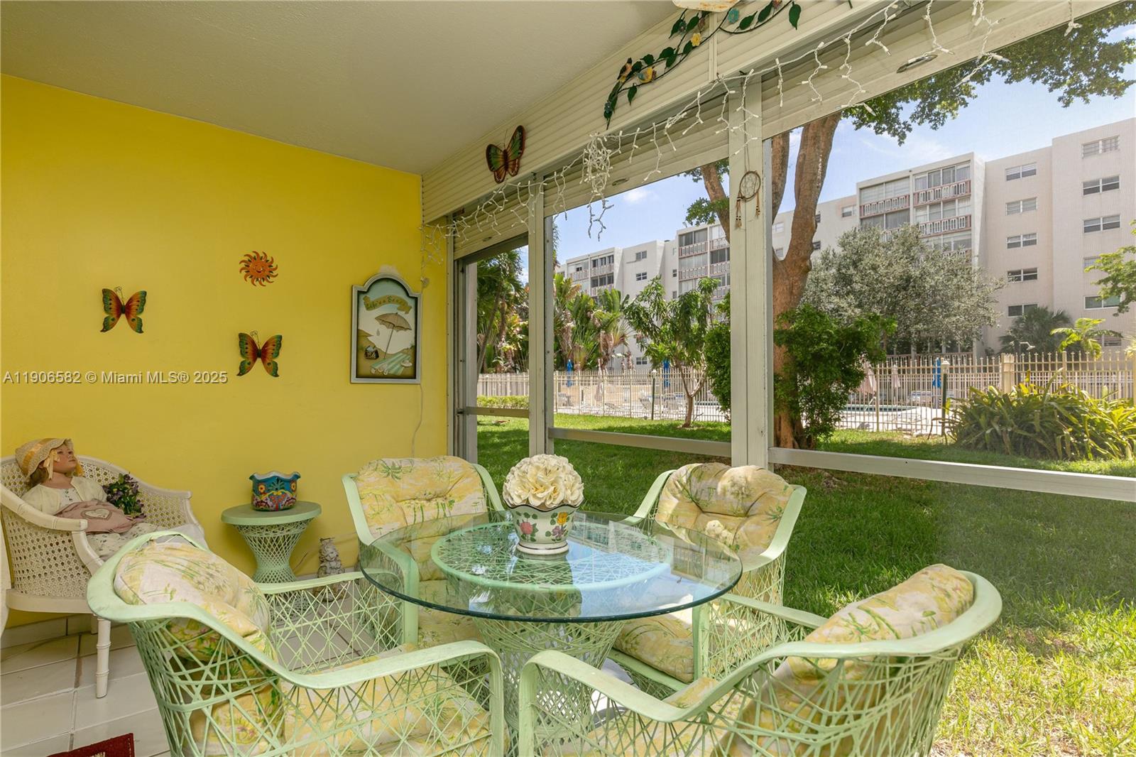 1001 Northeast 14th Avenue, Unit 107 Hallandale Beach, FL 33009 - Photo 13 of 28 a view of an outdoor dining space with furniture