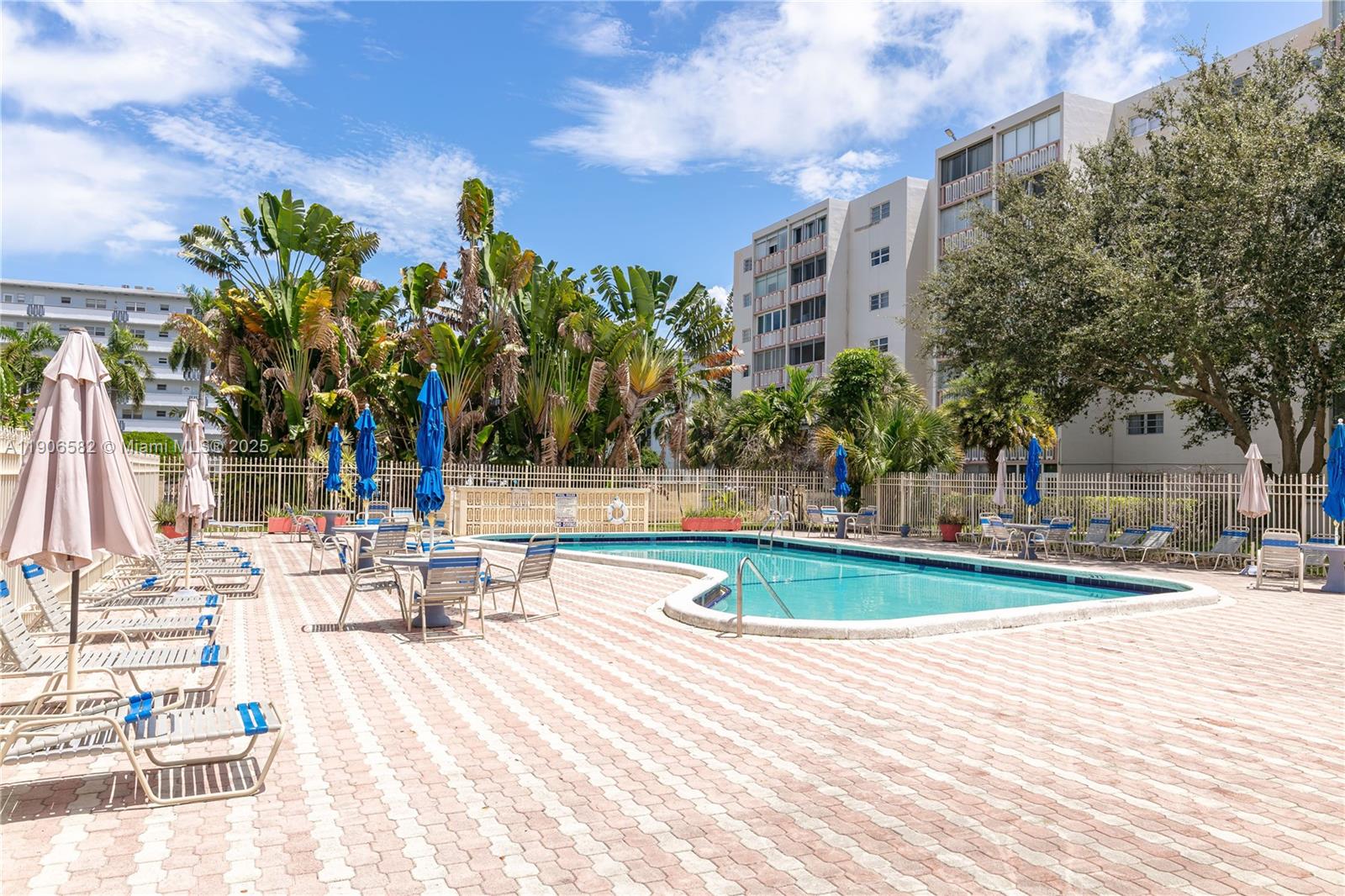 1001 Northeast 14th Avenue, Unit 107 Hallandale Beach, FL 33009 - Photo 24 of 28 a view of a swimming pool with a patio