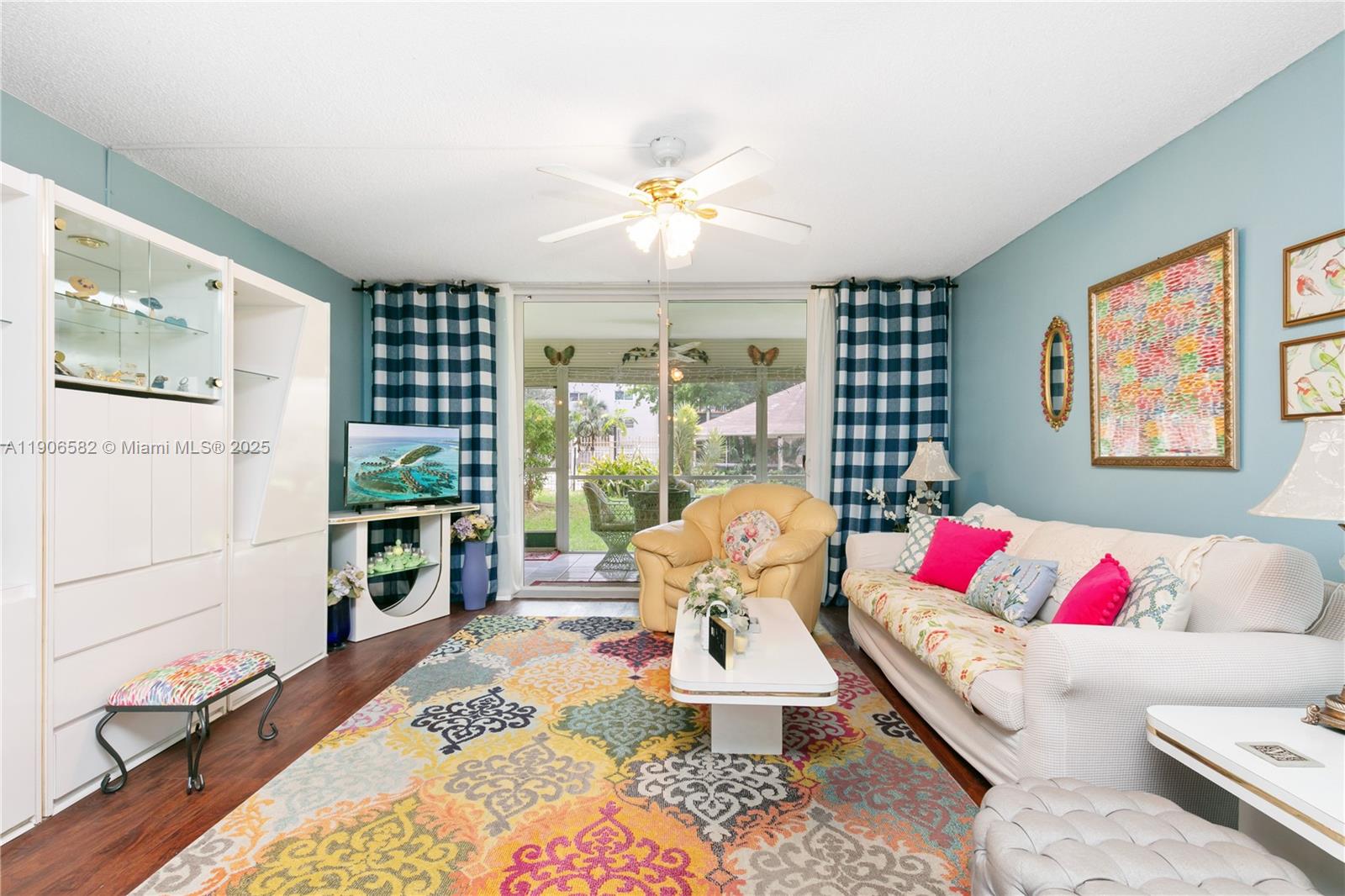 1001 Northeast 14th Avenue, Unit 107 Hallandale Beach, FL 33009 - Photo 3 of 28 a living room with furniture and a table