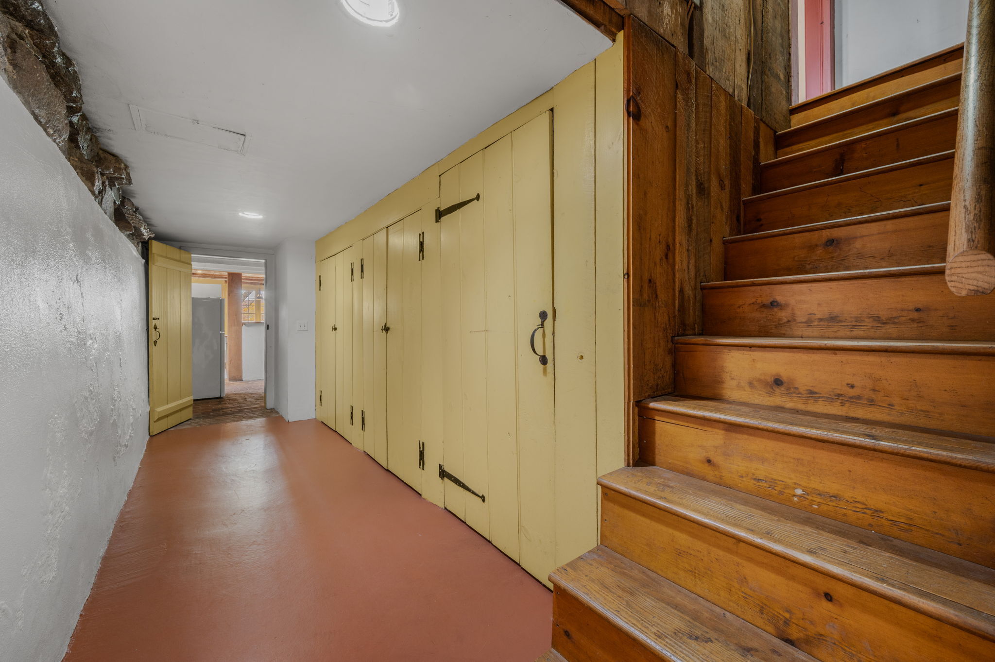 55-2 Beaver Brook Road Lyme, CT 06371 - Photo 28 of 40 Lower level hallway, stairs from Family room
