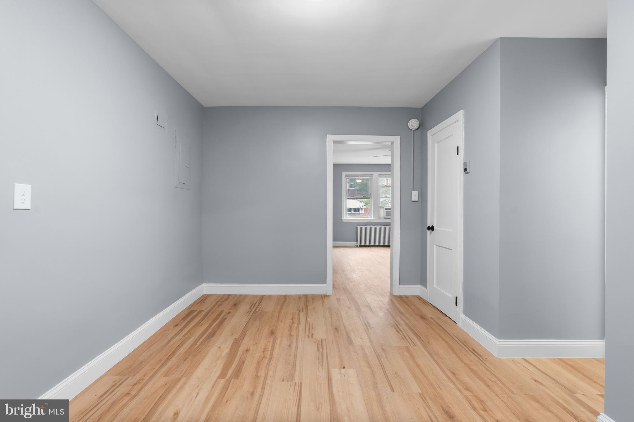 1721 29th Street Southeast, Unit 1 Washington, DC 20020 - Photo 15 of 24 a view of a room with wooden floor and a bathroom