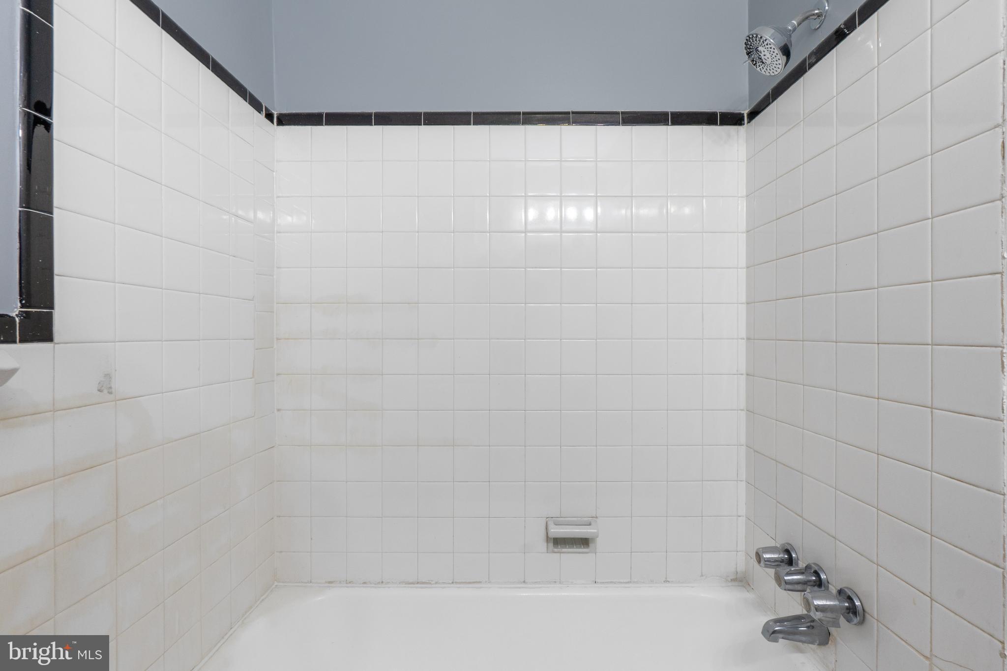 1721 29th Street Southeast, Unit 1 Washington, DC 20020 - Photo 17 of 24 a bathroom with a bathtub
