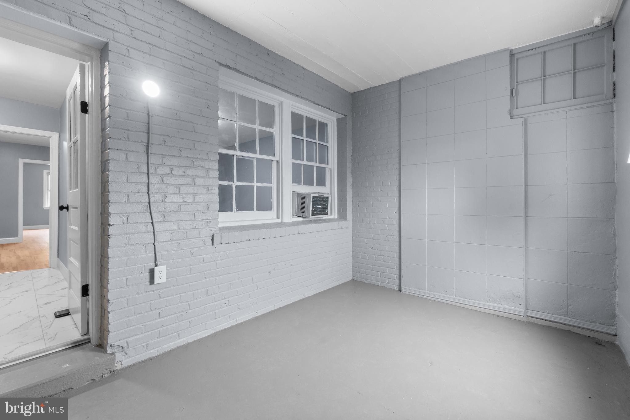 1721 29th Street Southeast, Unit 1 Washington, DC 20020 - Photo 19 of 24 an empty room with windows