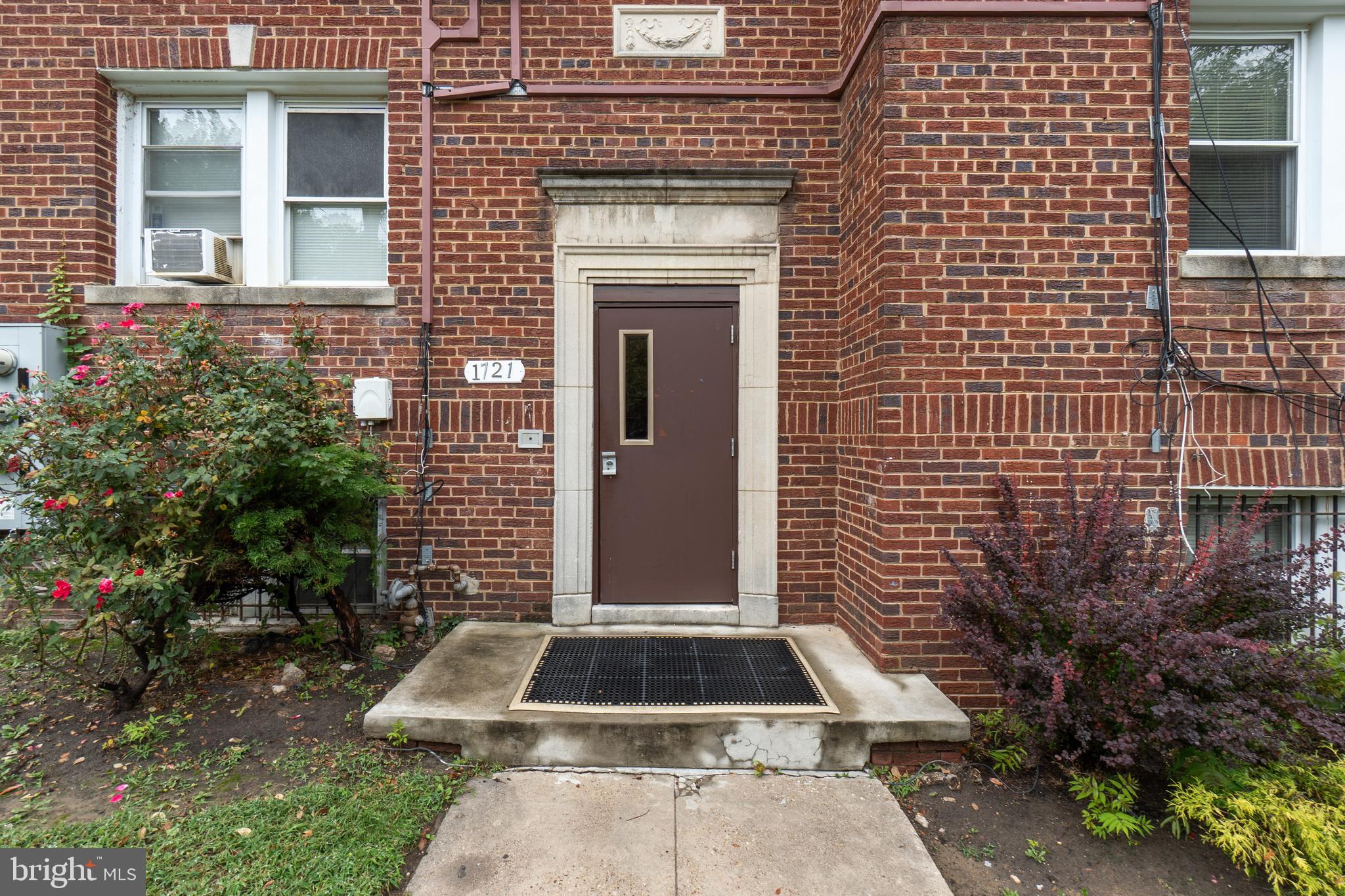 1721 29th Street Southeast, Unit 1 Washington, DC 20020 - Photo 2 of 24 a front view of a house with a yard