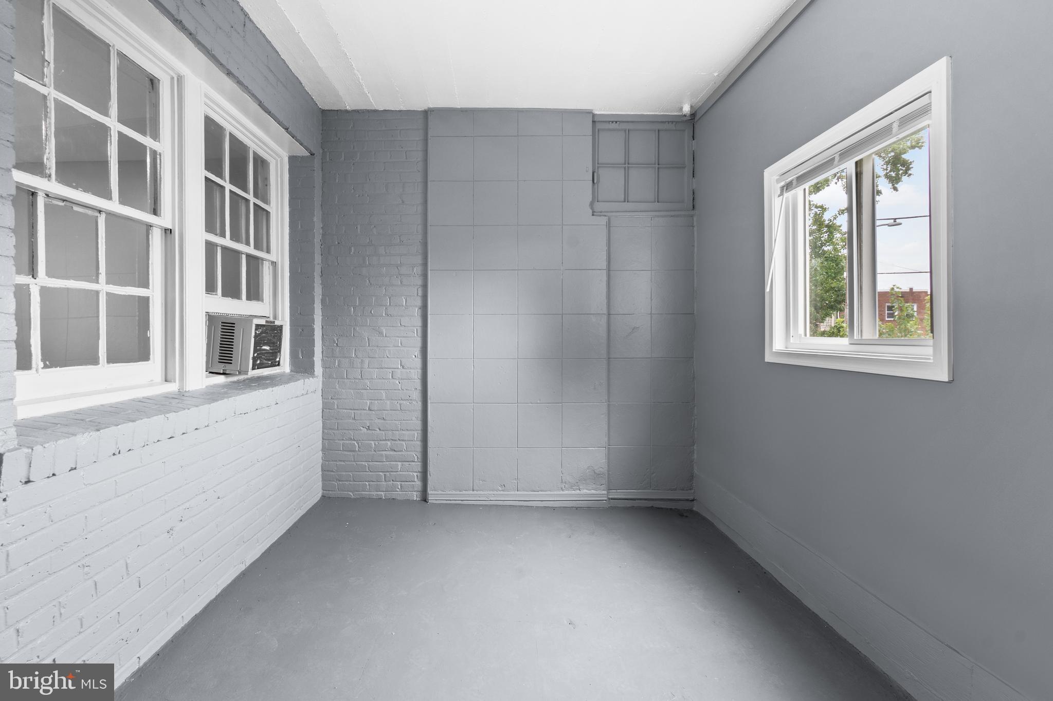 1721 29th Street Southeast, Unit 1 Washington, DC 20020 - Photo 20 of 24 an empty room with windows