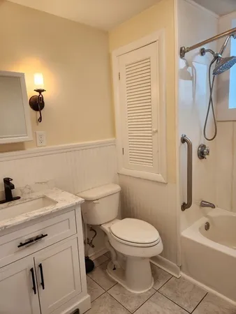 a bathroom with a sink a toilet and a bathtub