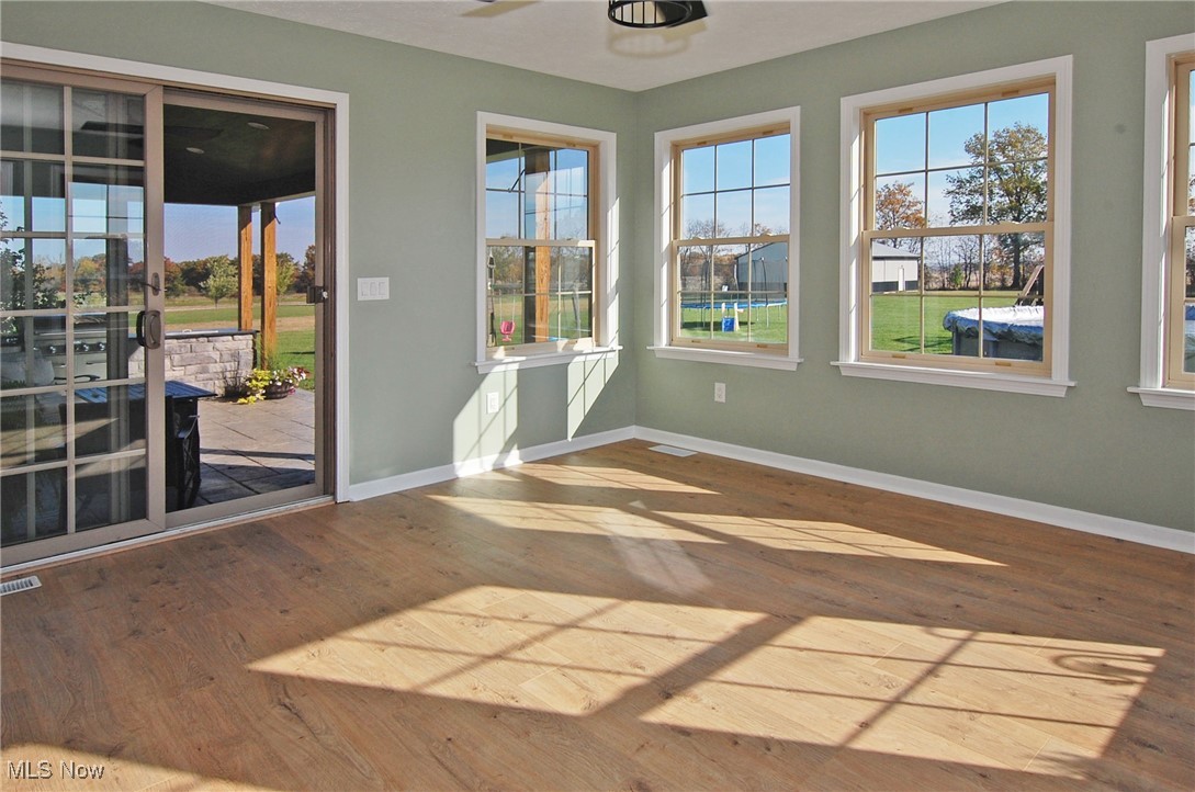 26875 W Road Wellington, OH 44090 - Photo 7 of 26 View of unfurnished sunroom