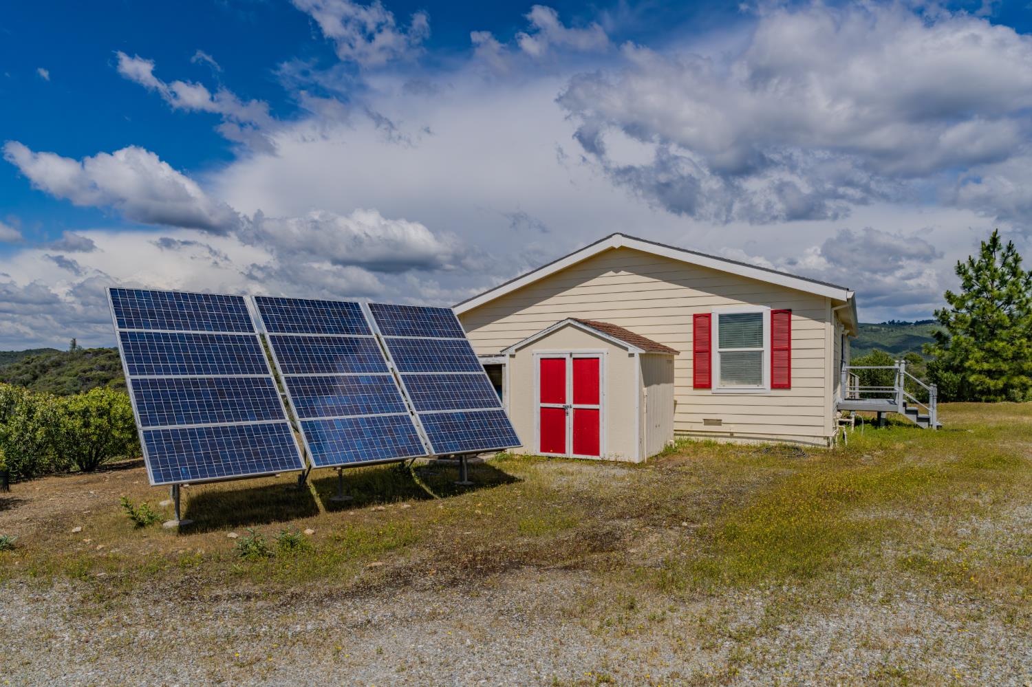 3155 Hawver Road San Andreas, CA 95249 - Photo 6 of 63 12 Solar panels located left of the Main Home. Storage shed houses the 16 deep cell batteries.
