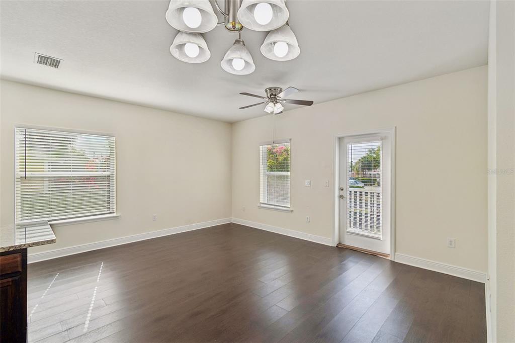 2322 West Chestnut Street Tampa, FL 33607 - Photo 13 of 27 an empty room with wooden floor and windows