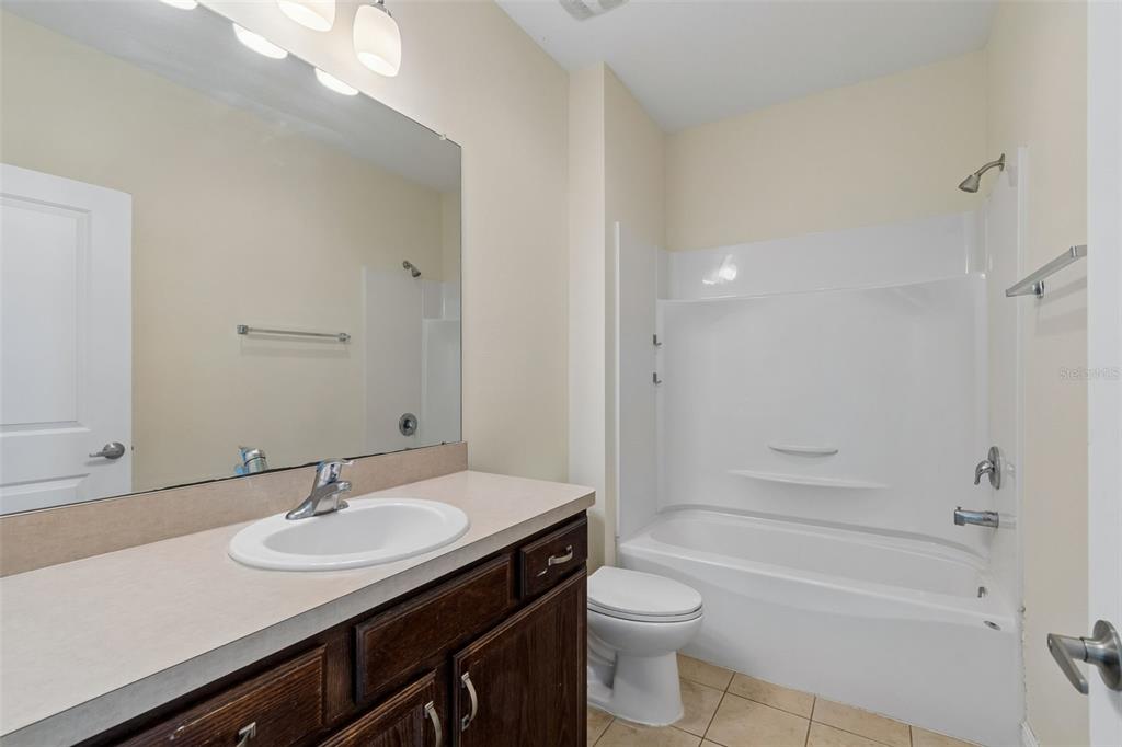 2322 West Chestnut Street Tampa, FL 33607 - Photo 17 of 27 a bathroom with a sink and a mirror