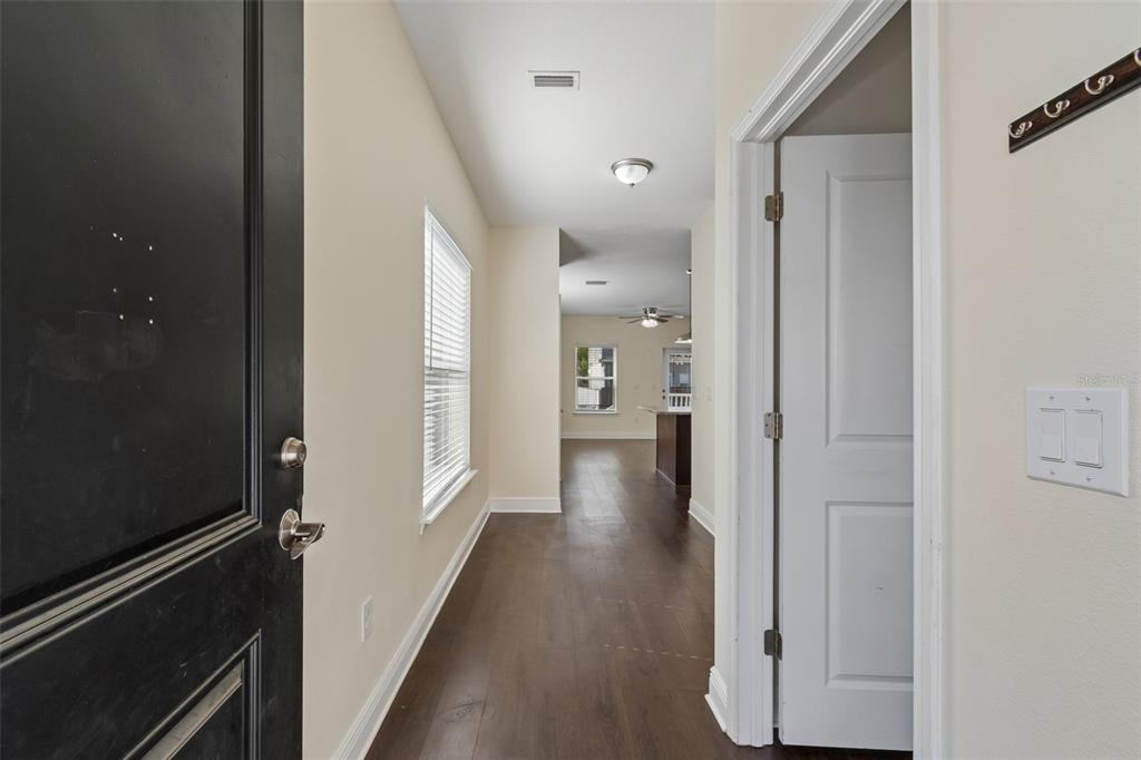 2322 West Chestnut Street Tampa, FL 33607 - Photo 4 of 27 a view of a hallway with wooden floor