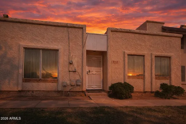 front view of a house with a yard