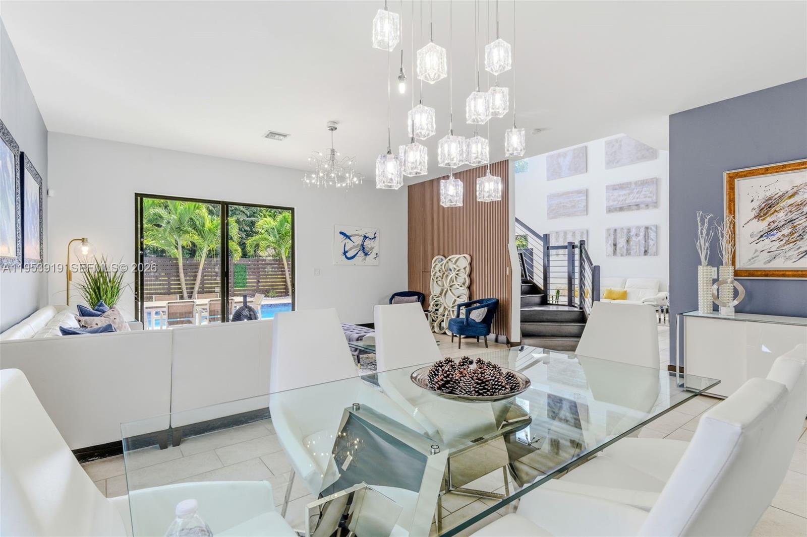 16044 Southwest 136 Way Miami, FL 33196 - Photo 12 of 64 a living room with furniture and a chandelier