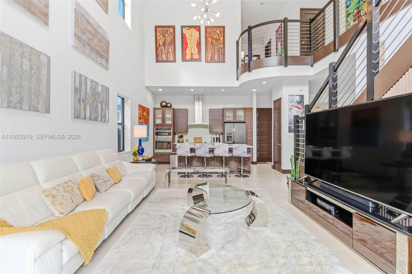 16044 Southwest 136 Way Miami, FL 33196 - Photo 16 of 64 a living room with patio furniture and a flat screen tv