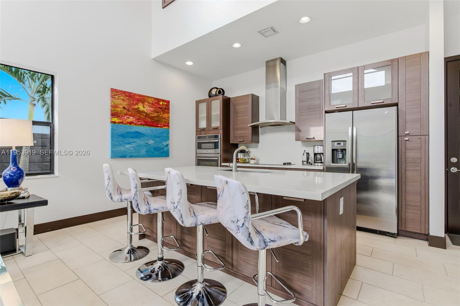 16044 Southwest 136 Way Miami, FL 33196 - Photo 19 of 64 a kitchen with stainless steel appliances kitchen island granite countertop a sink and a refrigerator