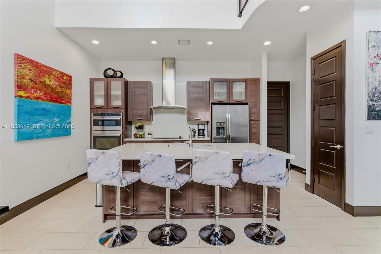 16044 Southwest 136 Way Miami, FL 33196 - Photo 20 of 64 a view of a dining room with furniture and wooden floor
