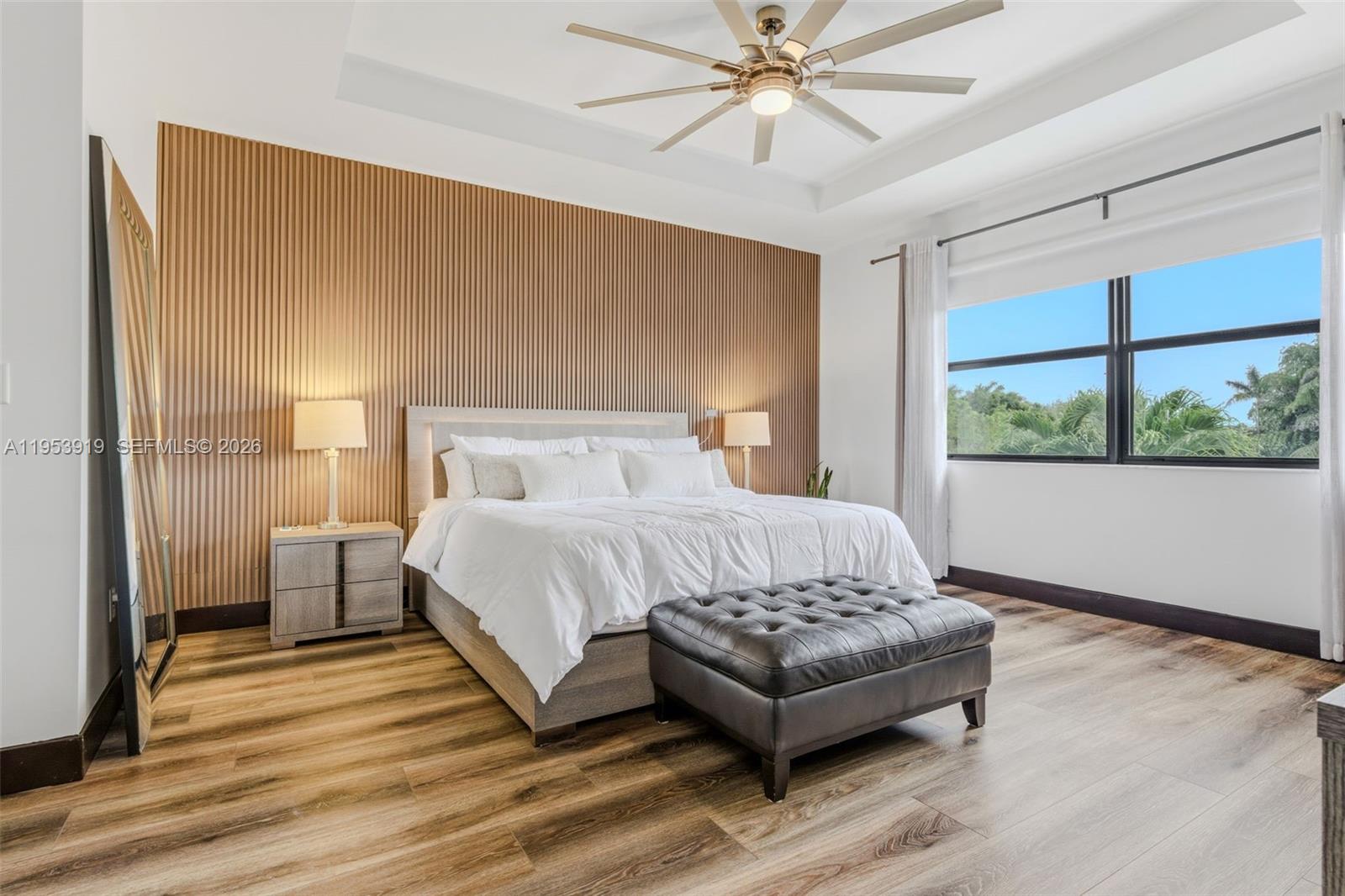 16044 Southwest 136 Way Miami, FL 33196 - Photo 23 of 64 a bedroom with a bed rug and wooden floor