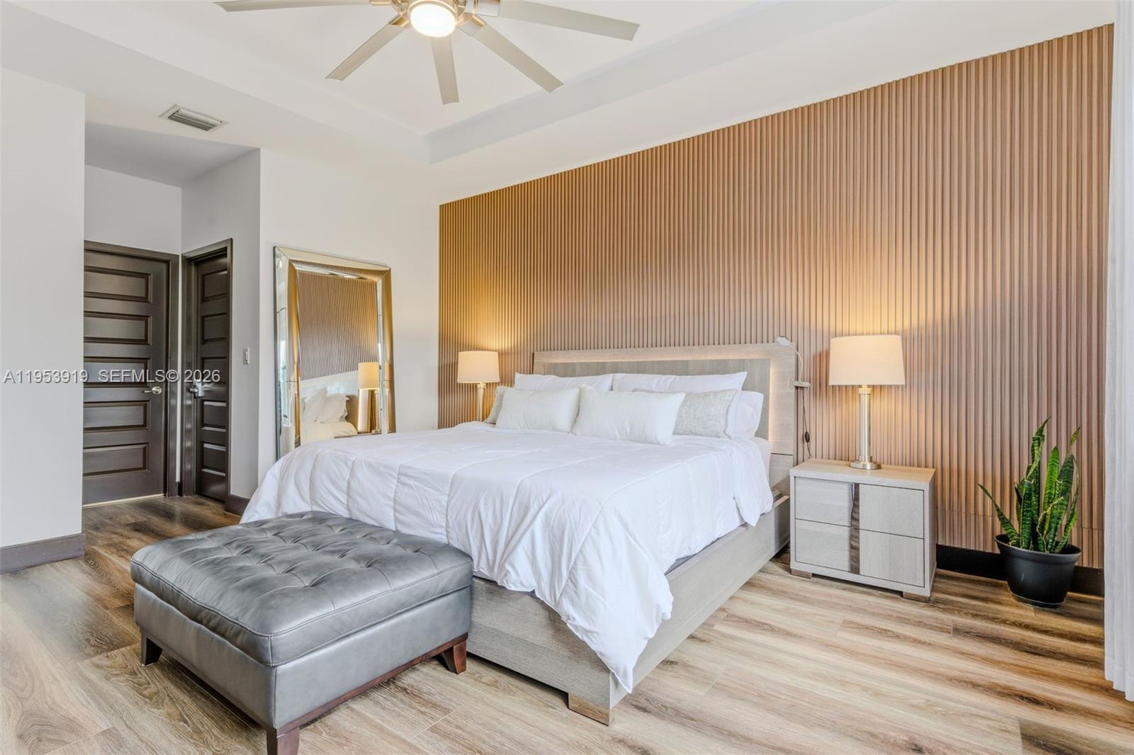 16044 Southwest 136 Way Miami, FL 33196 - Photo 26 of 64 a bedroom with a bed lamp and a fireplace