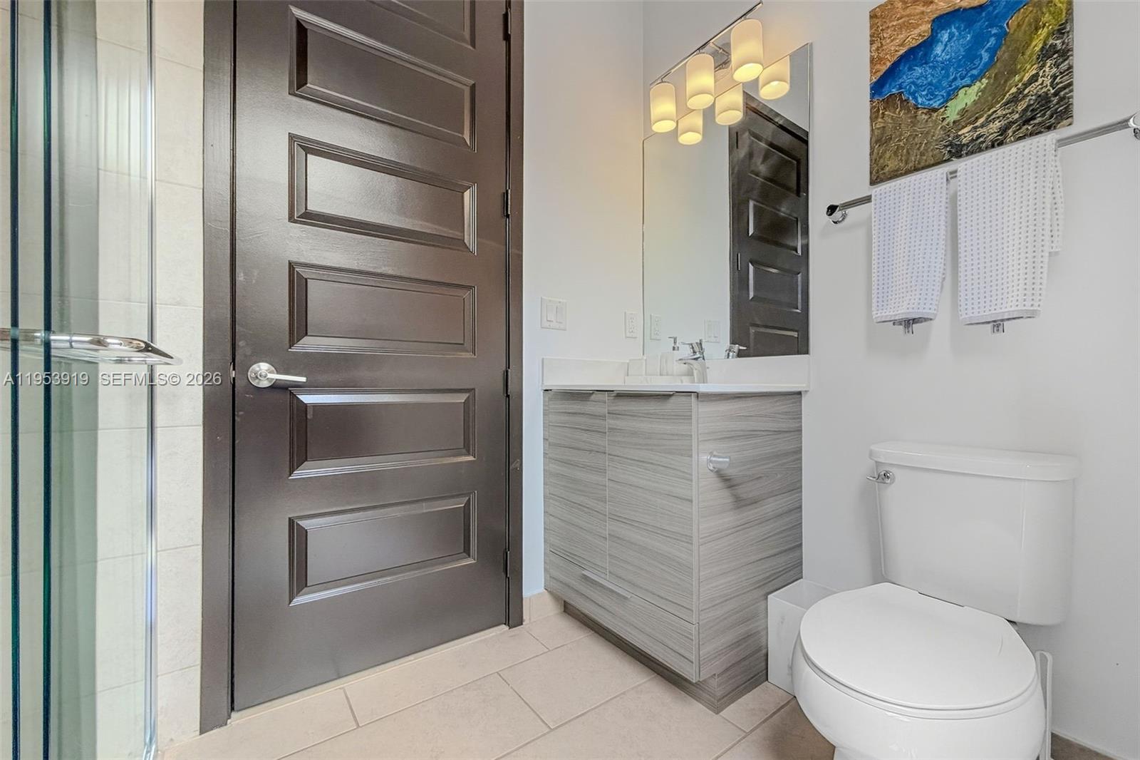 16044 Southwest 136 Way Miami, FL 33196 - Photo 33 of 64 a bathroom with a toilet and a shower