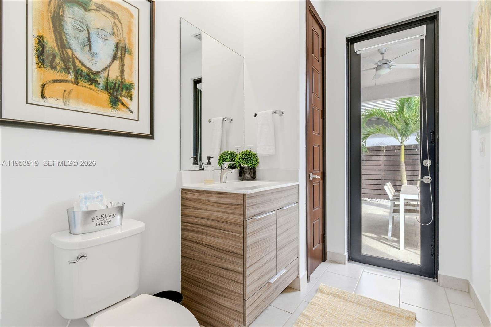 16044 Southwest 136 Way Miami, FL 33196 - Photo 34 of 64 a bathroom with a sink and a mirror