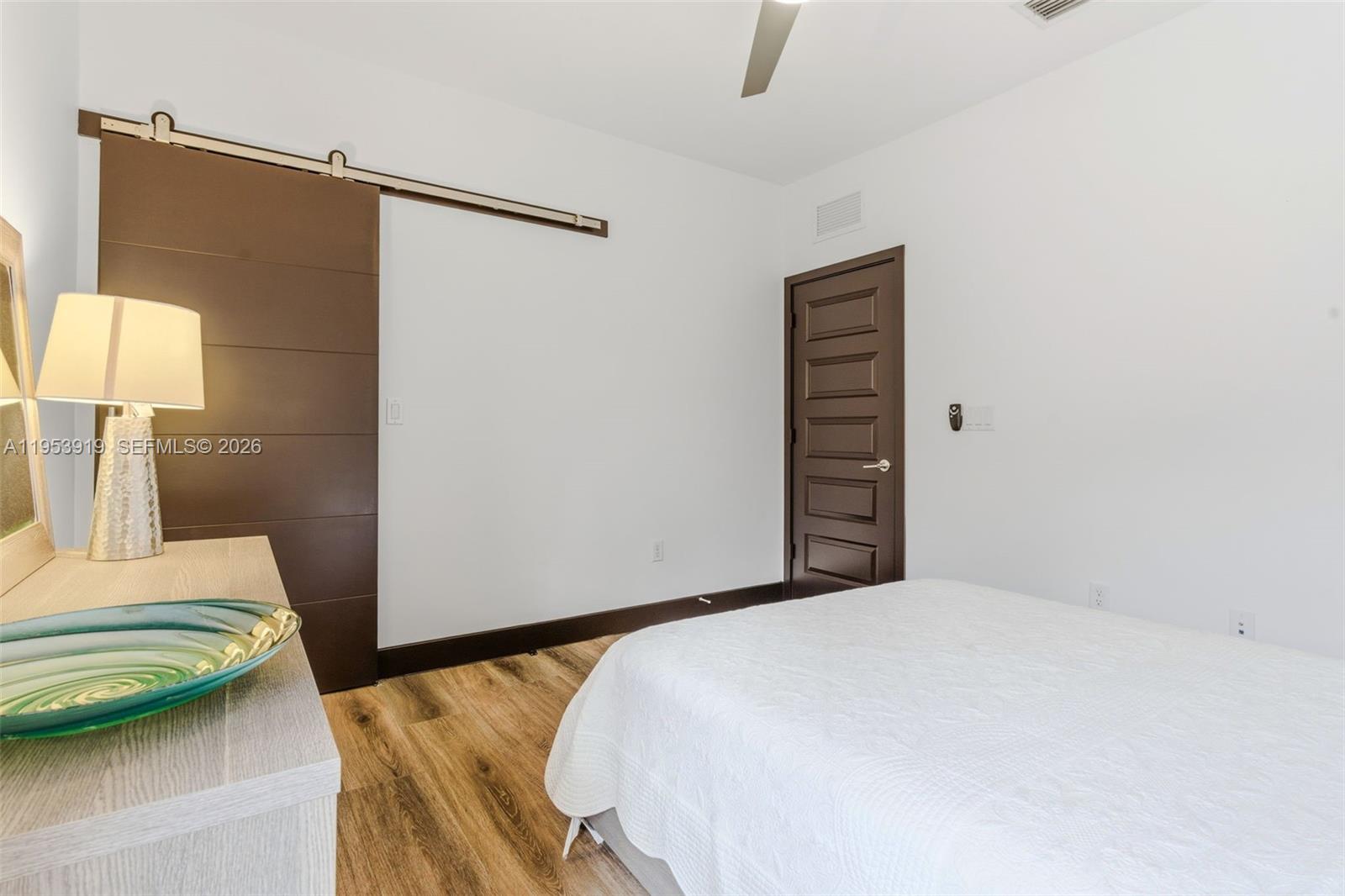 16044 Southwest 136 Way Miami, FL 33196 - Photo 39 of 64 a bedroom with a bed and a walk in closet