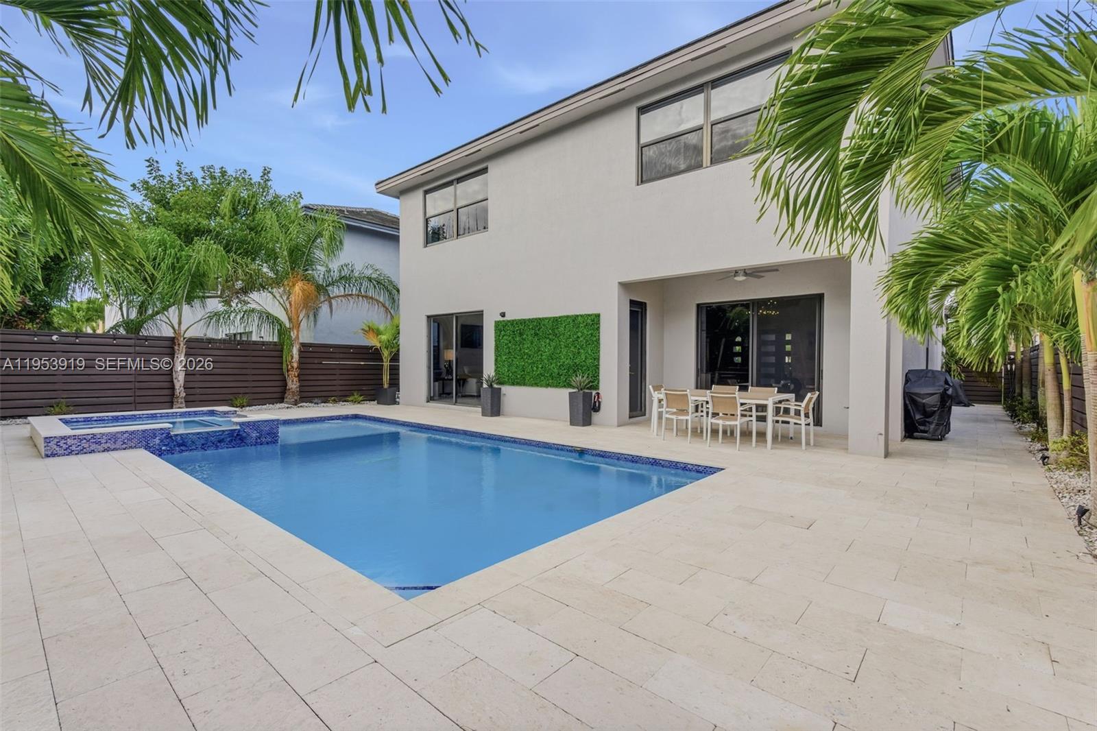 16044 Southwest 136 Way Miami, FL 33196 - Photo 49 of 64 a view of a backyard with a swimming pool