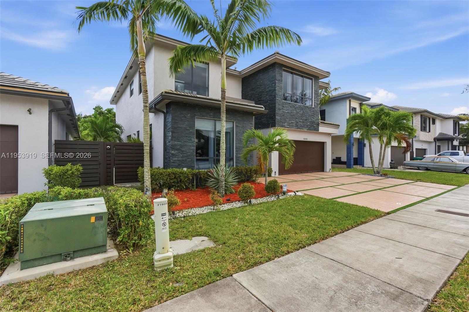 16044 Southwest 136 Way Miami, FL 33196 - Photo 55 of 64 a front view of a house with a yard
