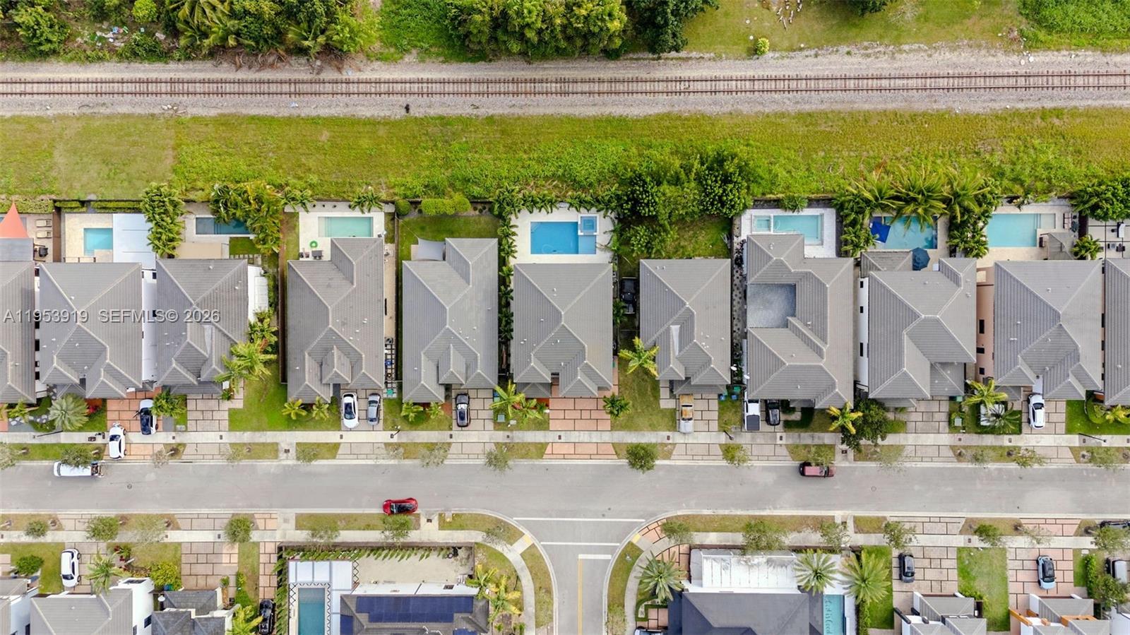 16044 Southwest 136 Way Miami, FL 33196 - Photo 59 of 64 a view of building with an outdoor space and seating area
