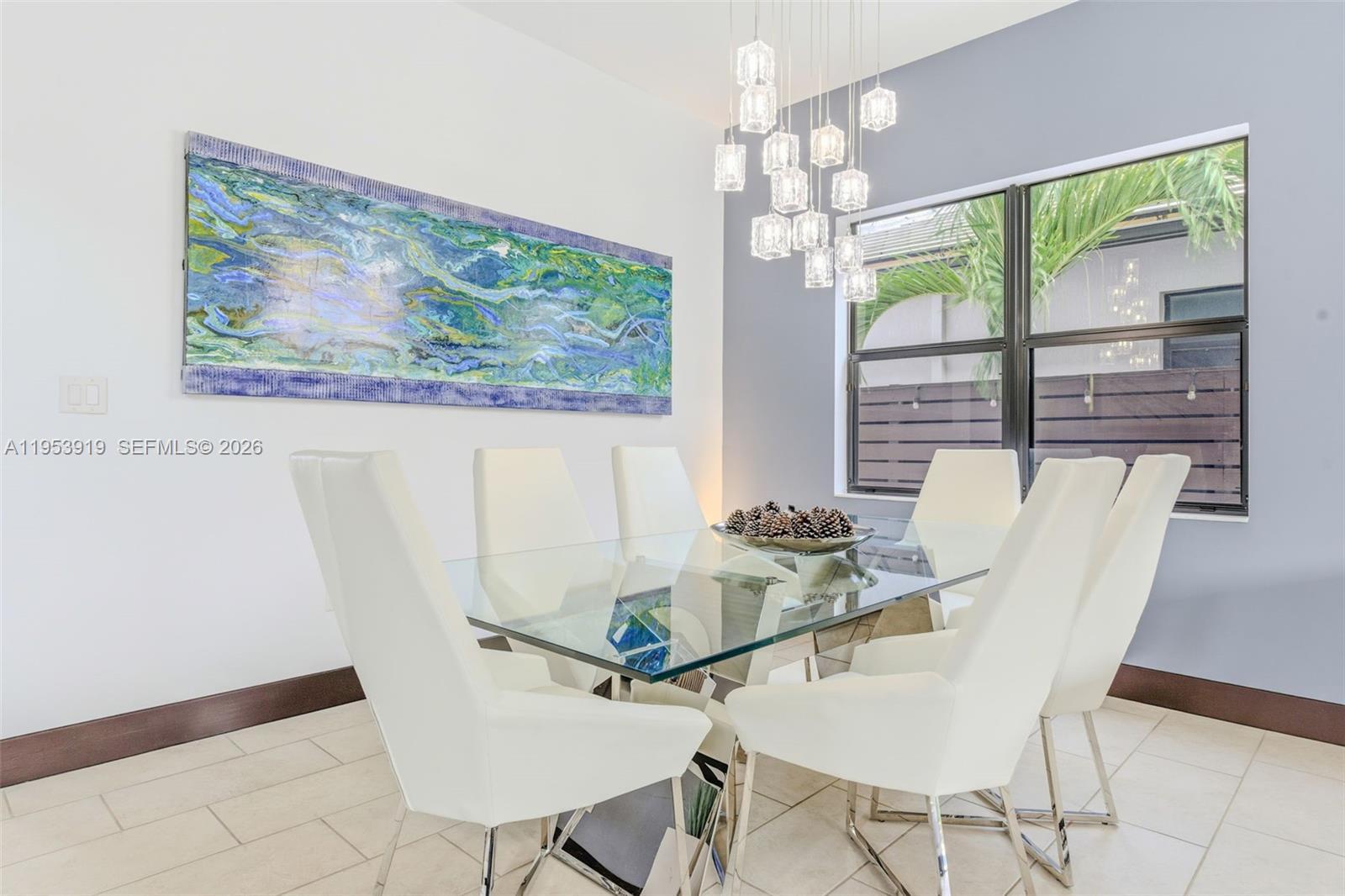 16044 Southwest 136 Way Miami, FL 33196 - Photo 10 of 64 a view of a dining room with furniture large windows and wooden floor